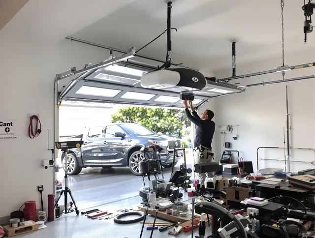Tamarac Garage Door Repair specialist installing smart garage door opener system in Tamarac home