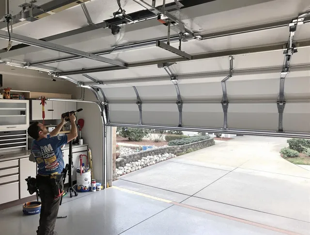 Garage door track repair service by Tamarac Garage Door Repair in Tamarac